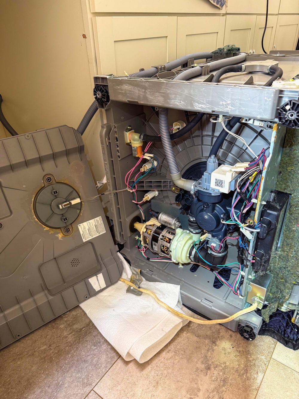 Appliance Rescue Team technician diagnosing a dishwasher that will not drain in Bergen County, NJ