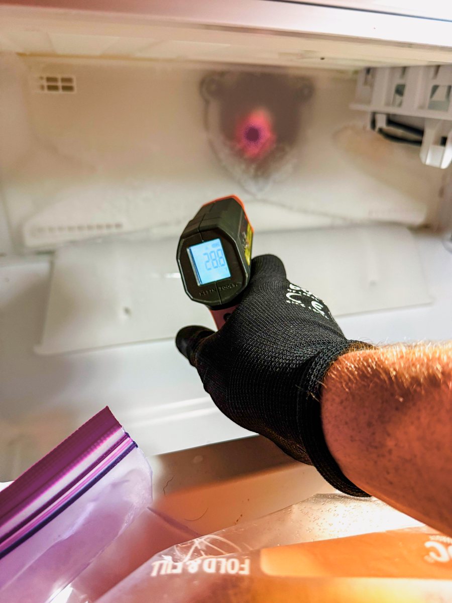 Appliance Rescue Team technician checking a refrigerator's temperature with an infrared thermometer — Appliance Rescue Team serves Closter, NJ