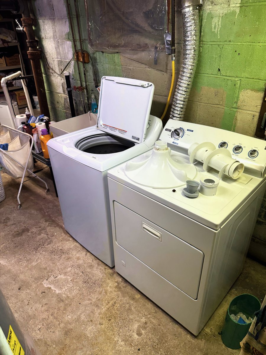 Top-load washer and dryer in a basement laundry room — Appliance Rescue Team serves Northvale, NJ