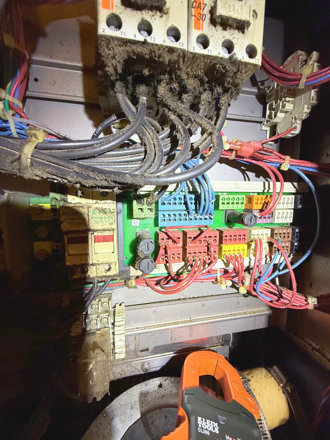 Inside the control cabinet: contactors and cable looms under years of grease-laden kitchen dust