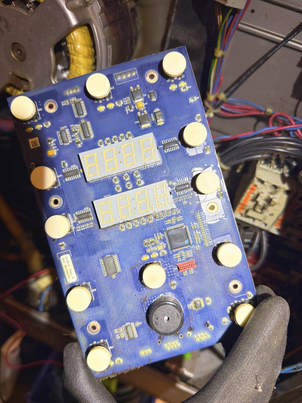 The display board that had shorted — two seven-segment readouts, the touch keys and the buzzer on one panel
