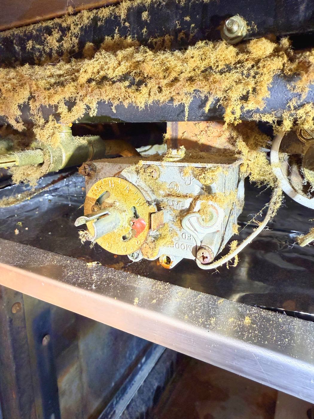 The safety valve the thermocouple has to hold open, under years of cooking debris