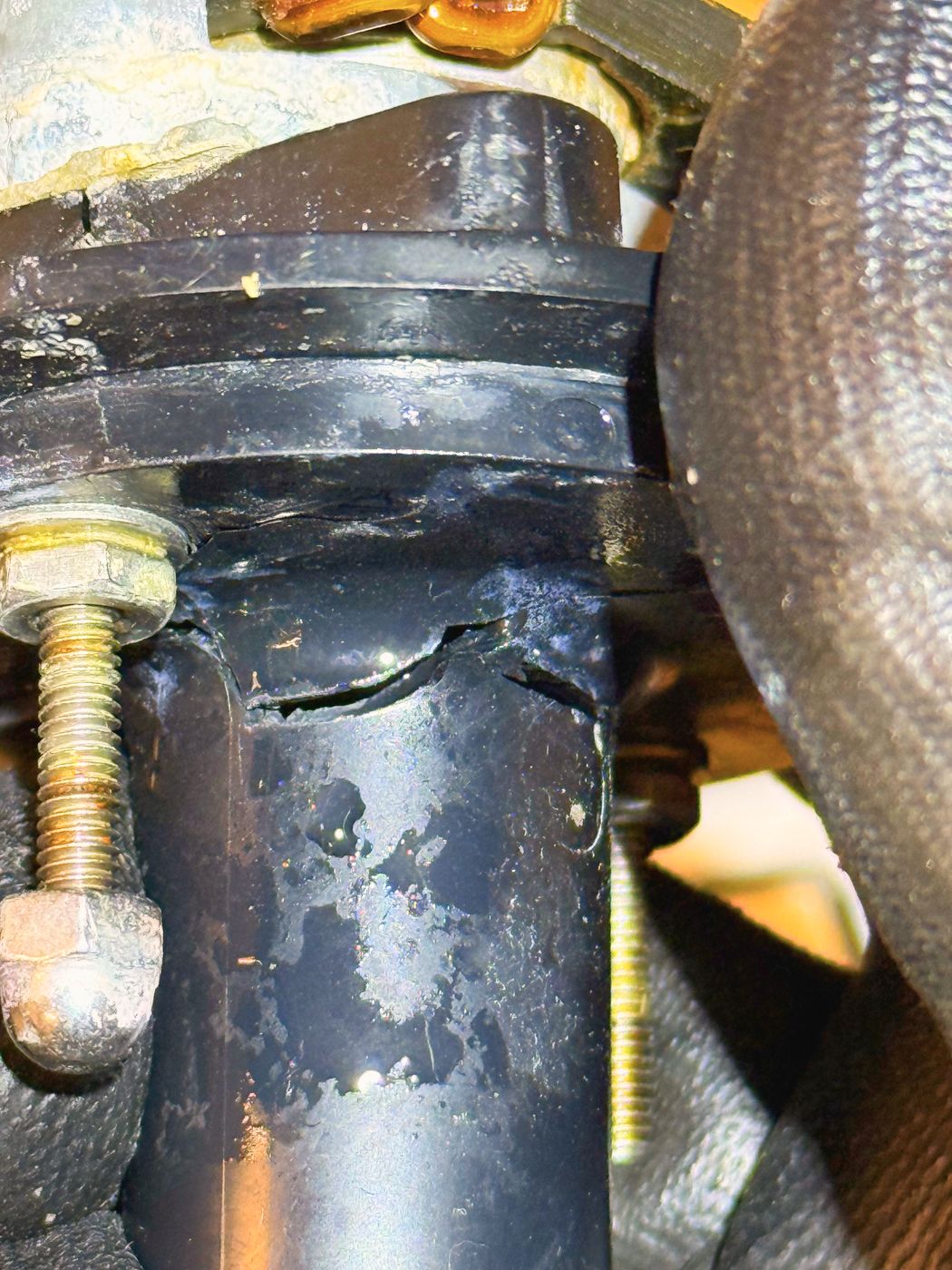 The split in the pump housing, running round the seam below the motor. The water meant for the evaporator was leaving here