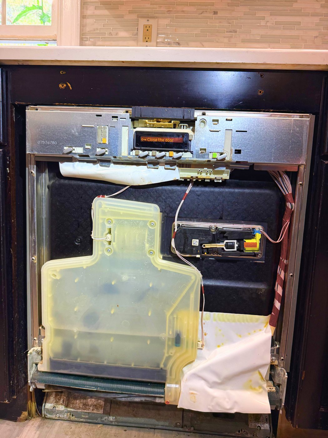 Inner door panel off. On this machine the control module, the loom and the door interlock all live inside the door