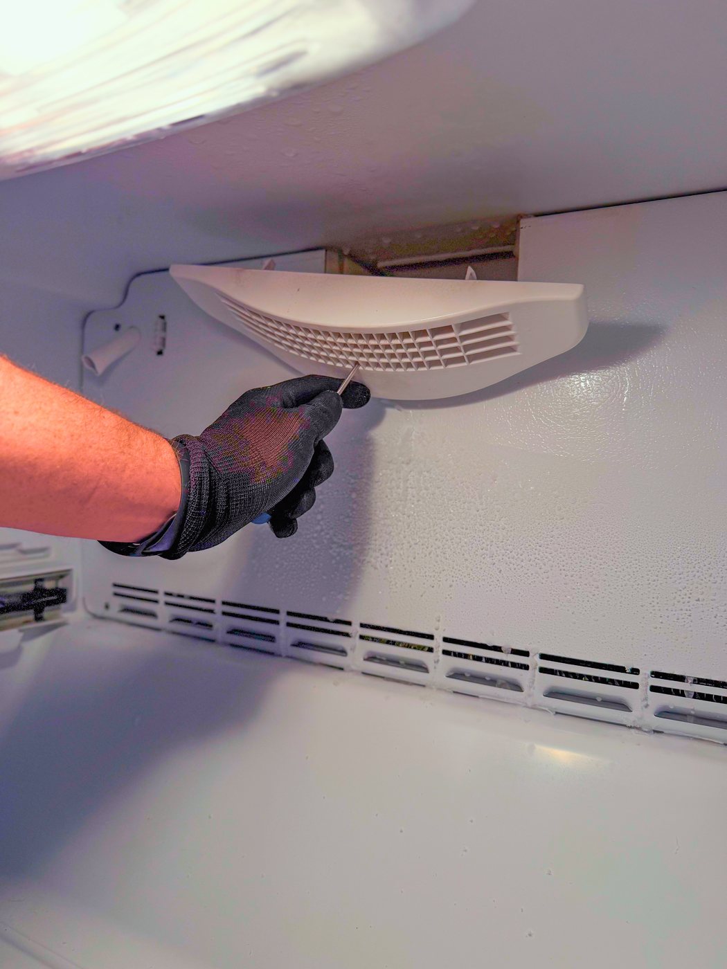 The duct that carries cold air up to the fresh food side. With the fan dead, nothing was moving through it