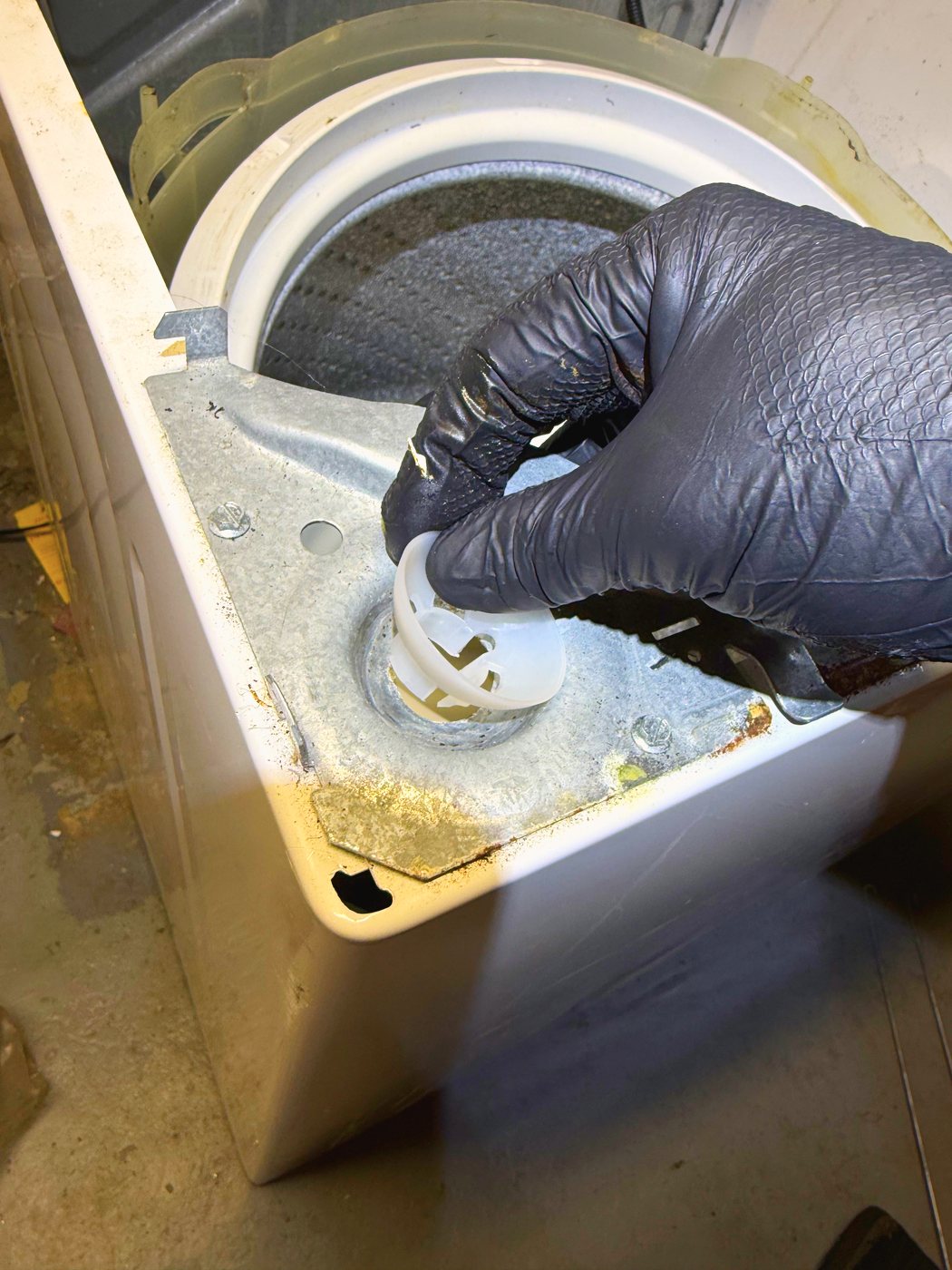Seating a new ball cap in its socket at the base of the cabinet