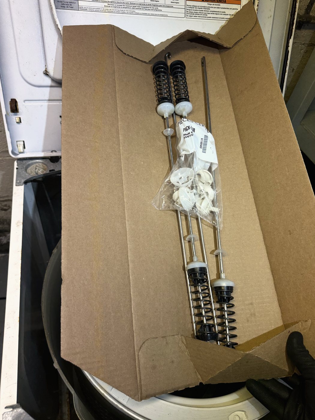 The replacement set: four suspension rods with their springs and ball caps, supplied as one kit because they wear as one